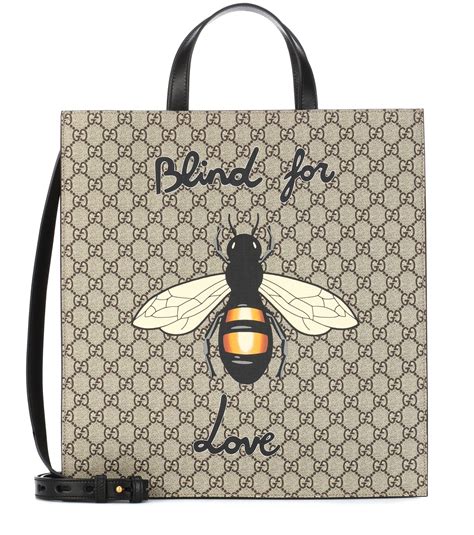 gucci bee print top|Gucci shopping bags.